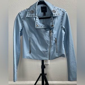 It’s a light blue, I really love this Jacket. It remind me of MJ style